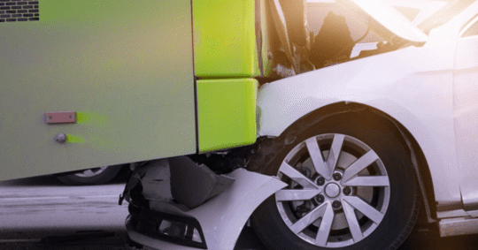 Bus crashing in to a car