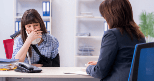 woman crying at desk